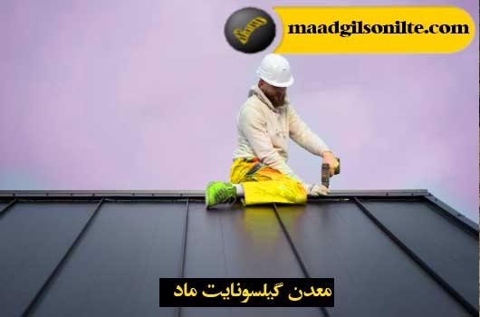 An image of a man who, as a bituminous waterproofing specialist, is working on a building and is using his tools to install bituminous waterproofing.